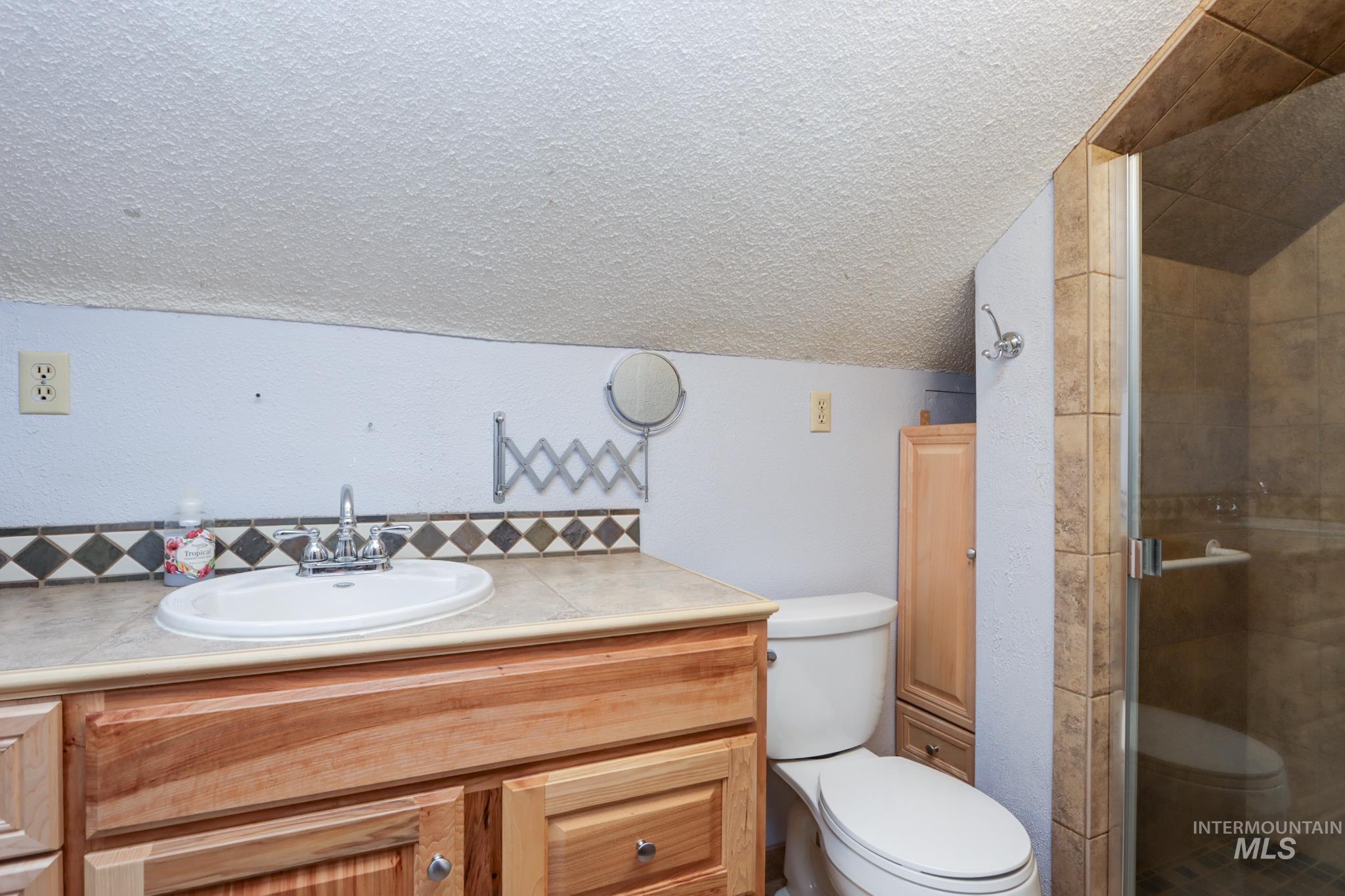 2528 Waterwheel Road Emmett, ID 83617 - Photo 39 of 50 Single-story property featuring a covered porch, white siding, and a green metal roof