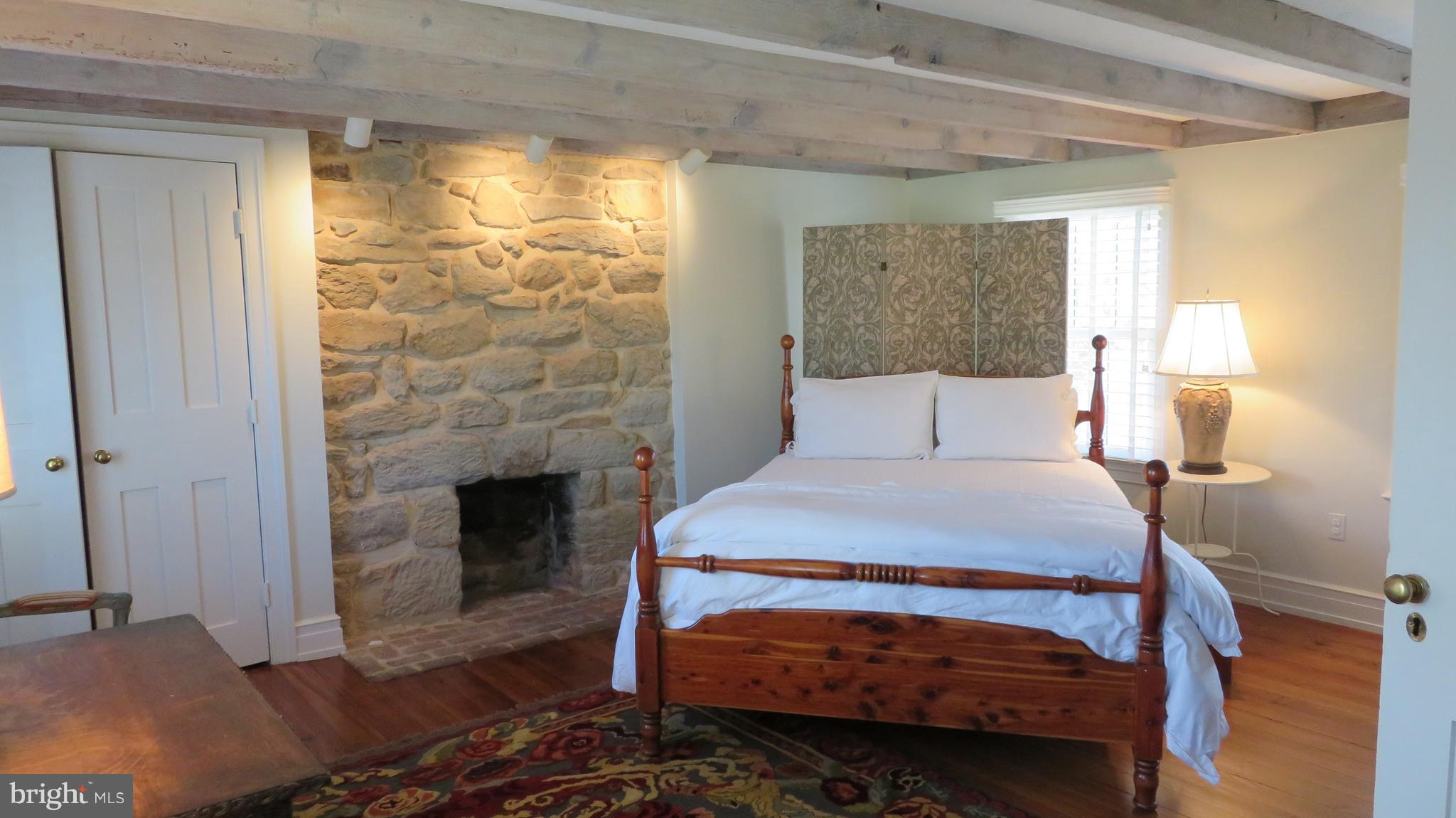 62 Hope Hill Road Castleton, VA 22716 - Photo 41 of 80 a bedroom with a bed and a fireplace