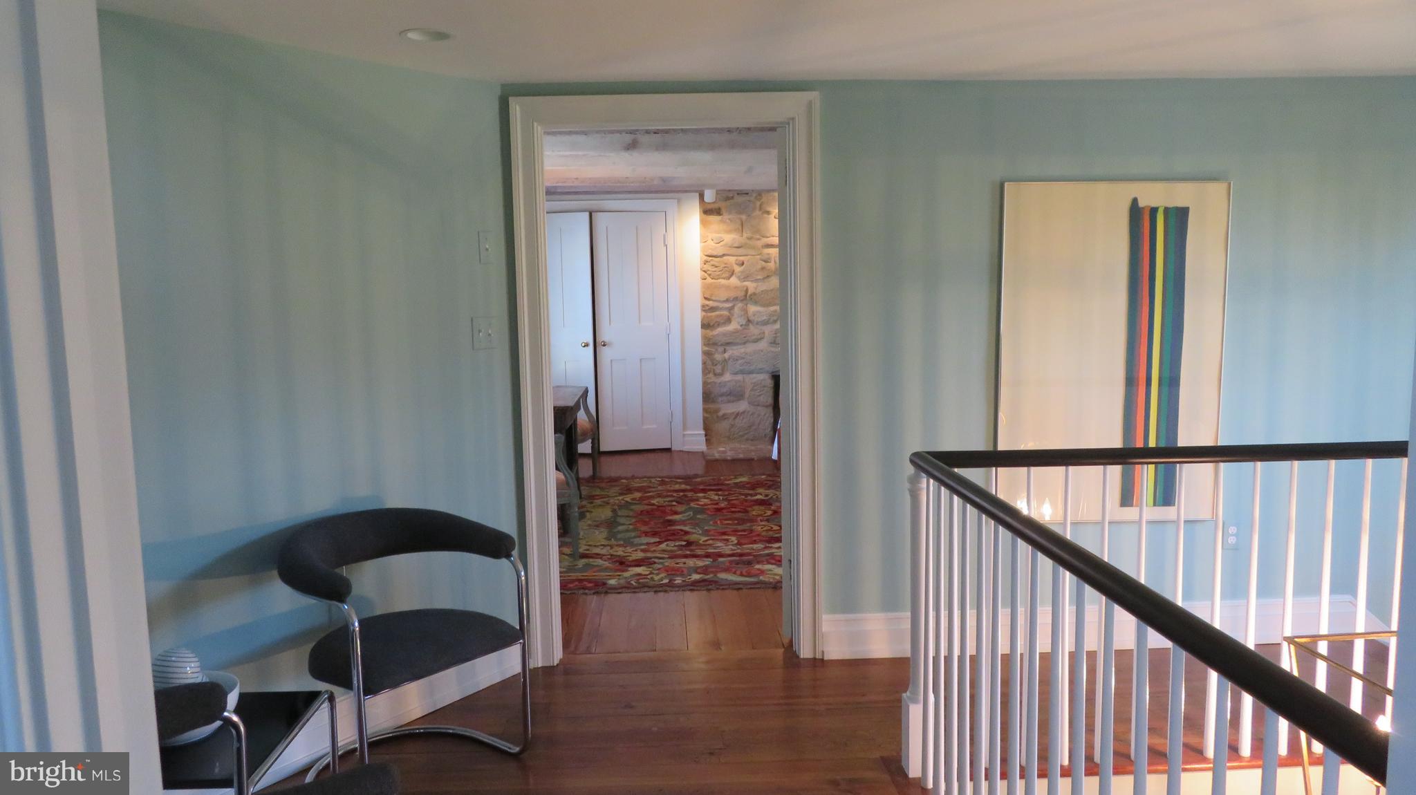 62 Hope Hill Road Castleton, VA 22716 - Photo 42 of 80 a view of a hallway and dining room with wooden floor