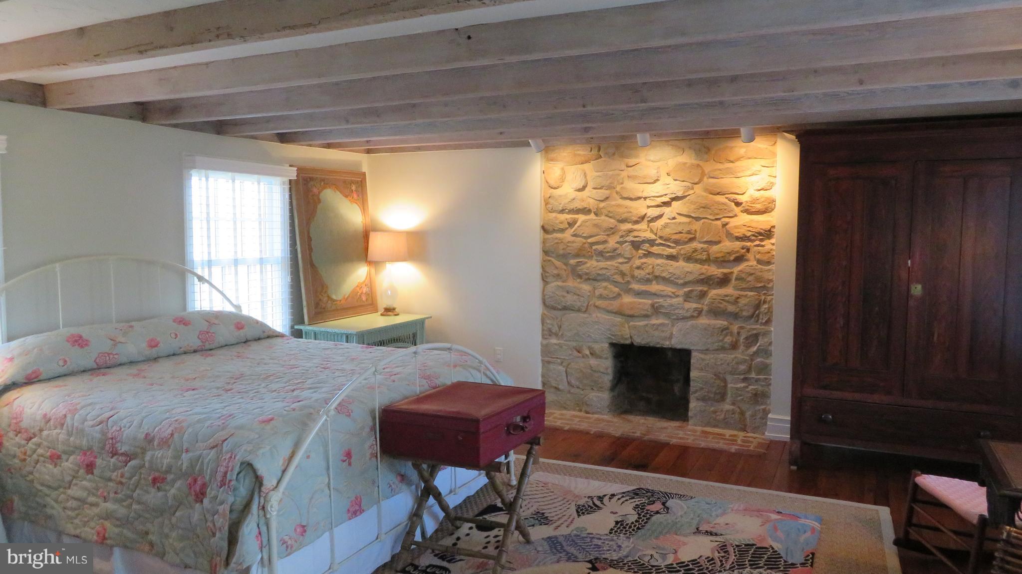 62 Hope Hill Road Castleton, VA 22716 - Photo 44 of 80 a bedroom with a bed and a fireplace