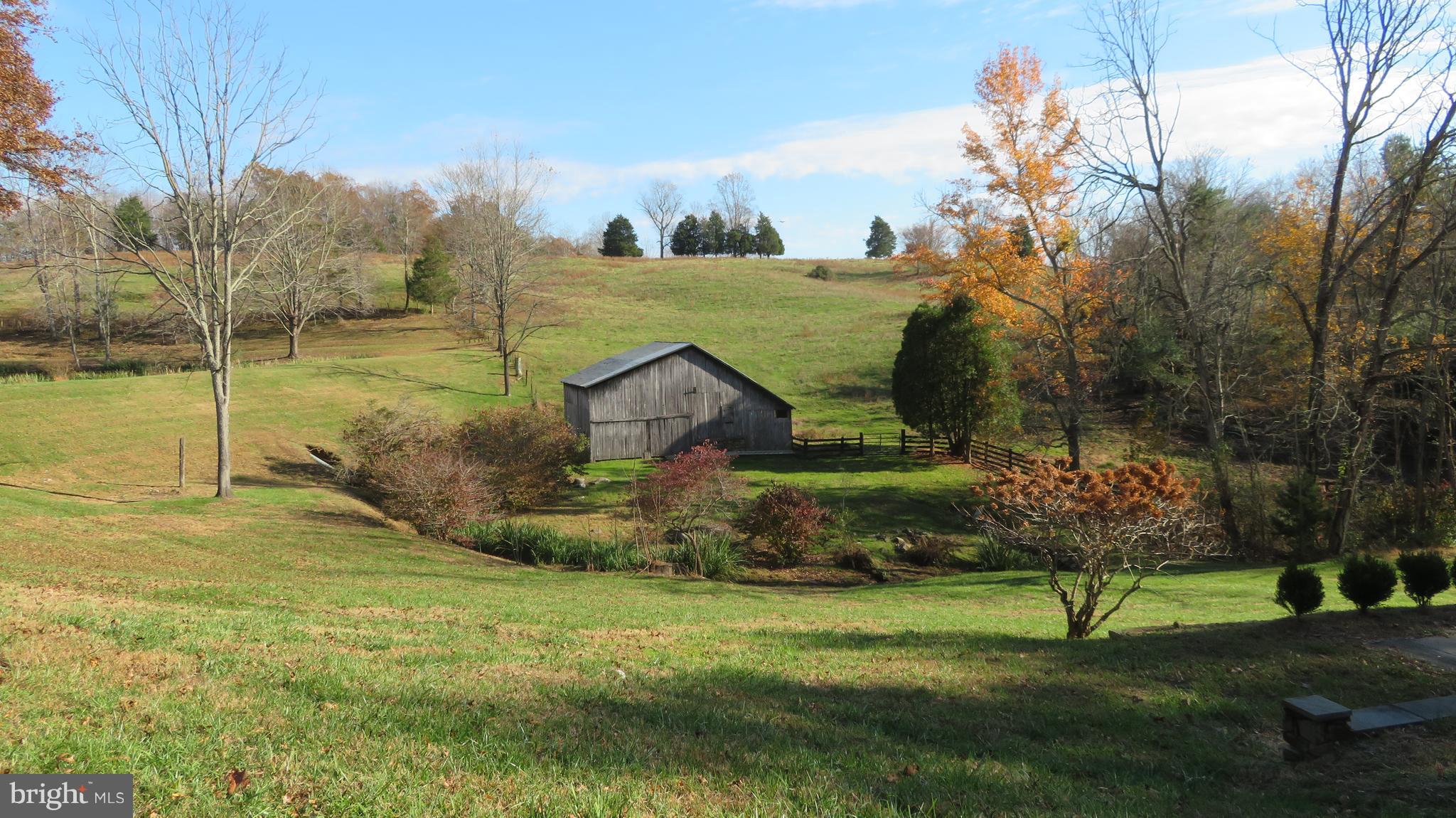 62 Hope Hill Road Castleton, VA 22716 - Photo 49 of 80 a view of a garden with a bench