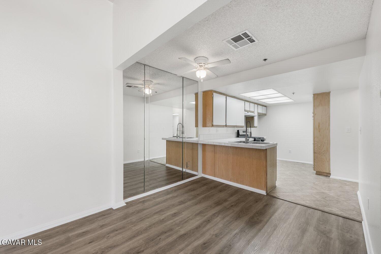44526 15th Street East, Unit 4 Lancaster, CA 93535 - Photo 11 of 52 a spacious bathroom with a sink and a mirror