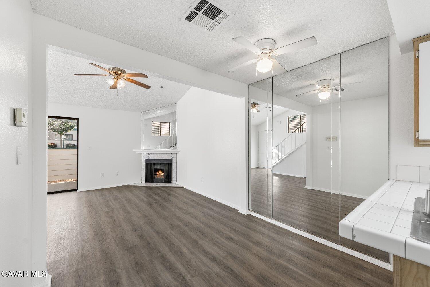44526 15th Street East, Unit 4 Lancaster, CA 93535 - Photo 14 of 52 wooden floor in an empty room with a window