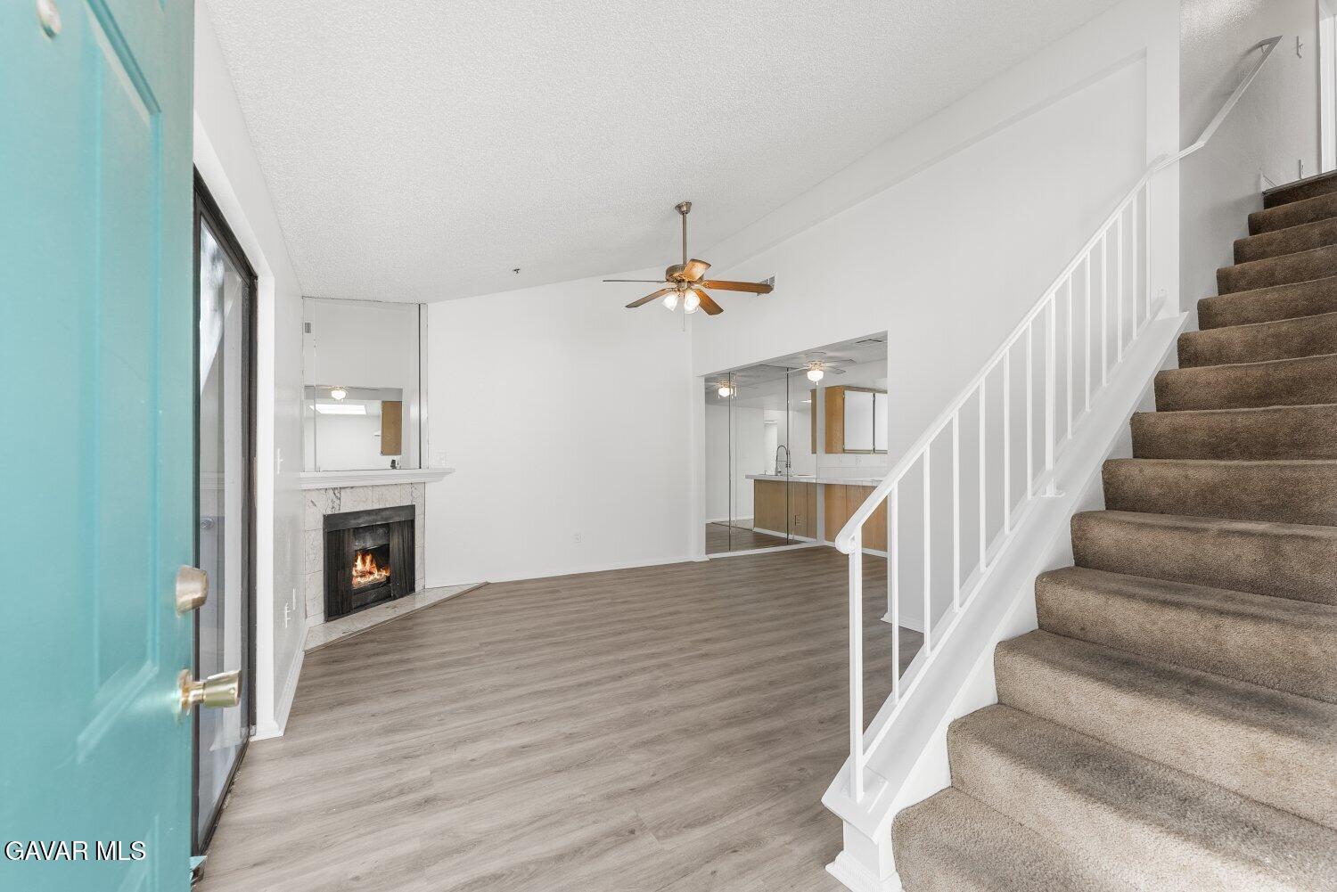 44526 15th Street East, Unit 4 Lancaster, CA 93535 - Photo 3 of 52 a view of an entryway with wooden floor and a livingroom