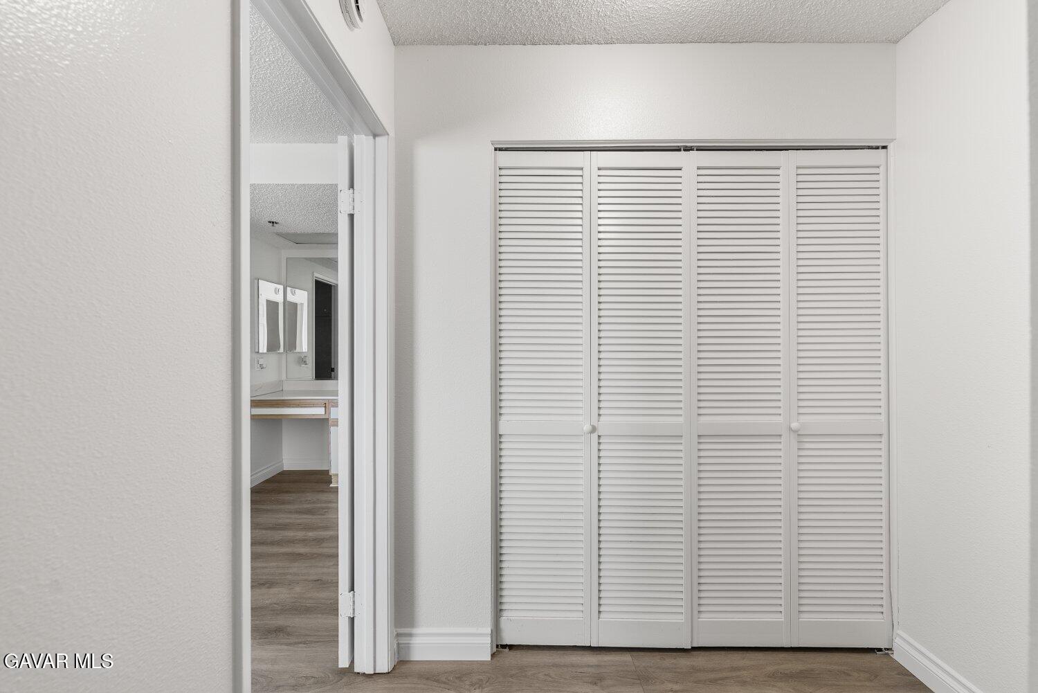 44526 15th Street East, Unit 4 Lancaster, CA 93535 - Photo 36 of 52 a view of utility room with wooden floor