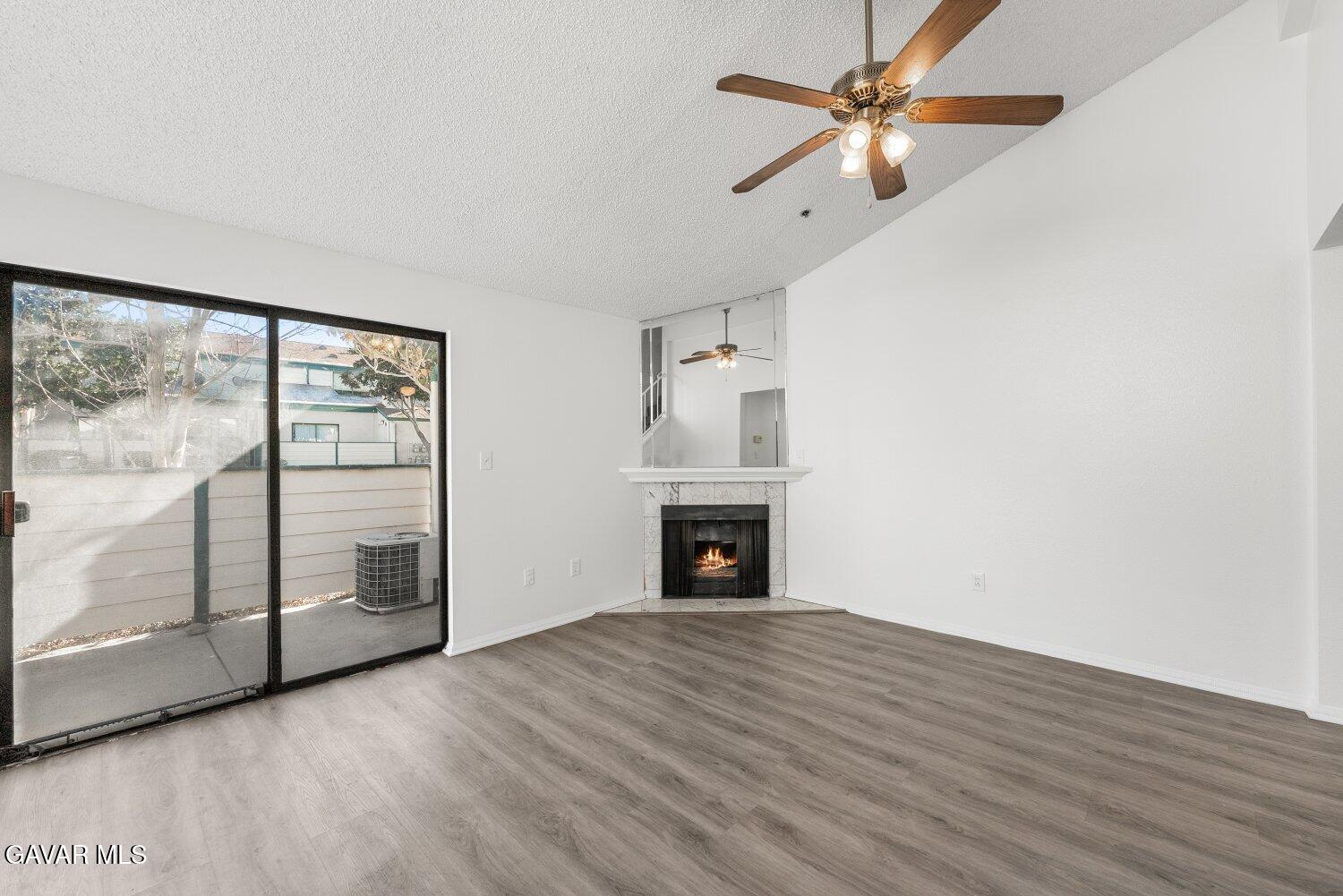 44526 15th Street East, Unit 4 Lancaster, CA 93535 - Photo 4 of 52 a view of empty room with wooden floor and fan