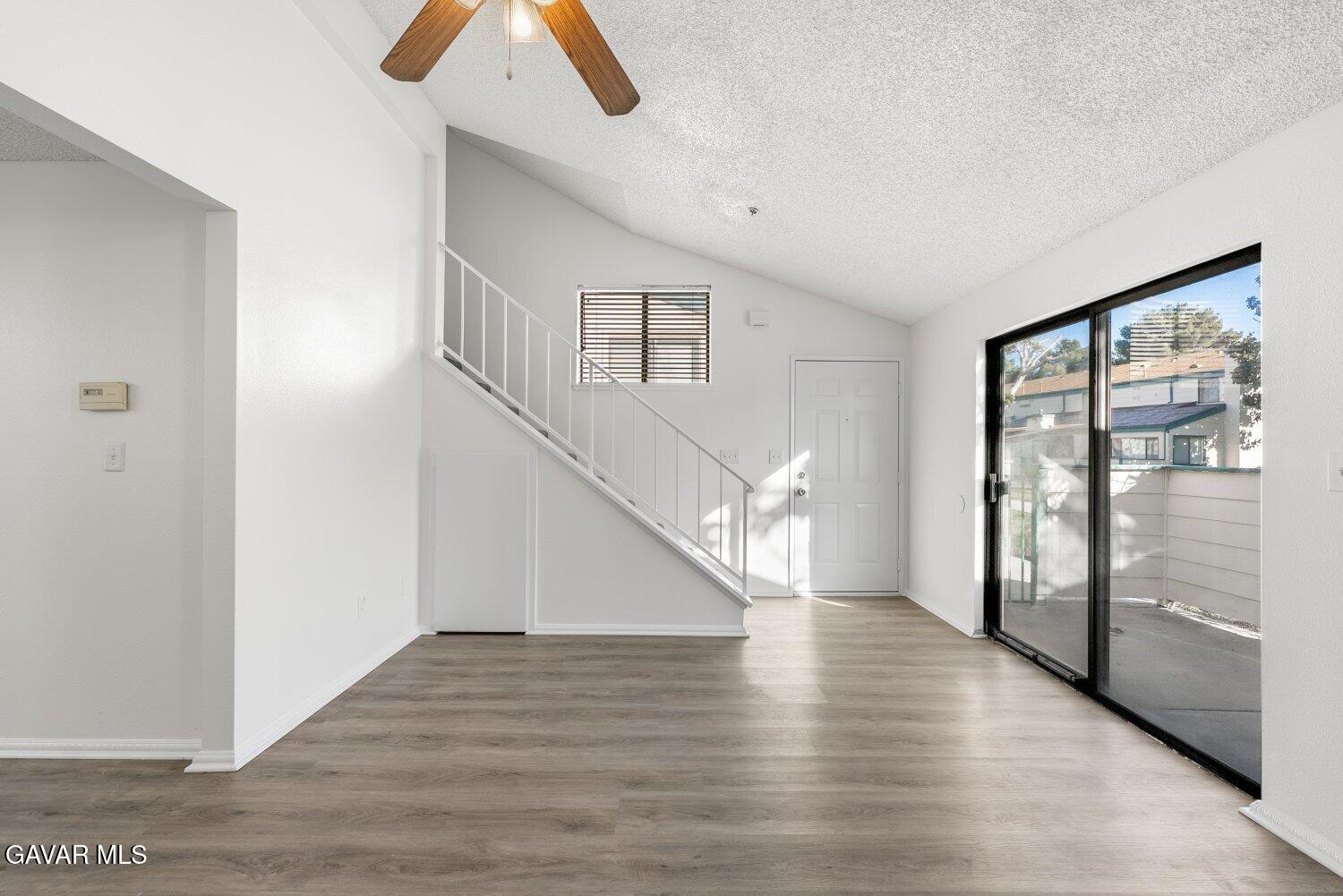 44526 15th Street East, Unit 4 Lancaster, CA 93535 - Photo 7 of 52 a view of entryway and hall with wooden floor