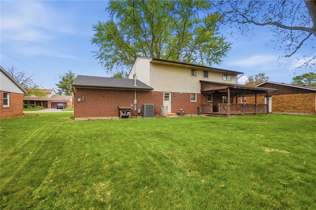 150 Littlejohn Road Troy, OH 45373 - Photo 36 of 40 This residence features a spacious yard and a charming back porch, perfect for outdoor enjoyment.