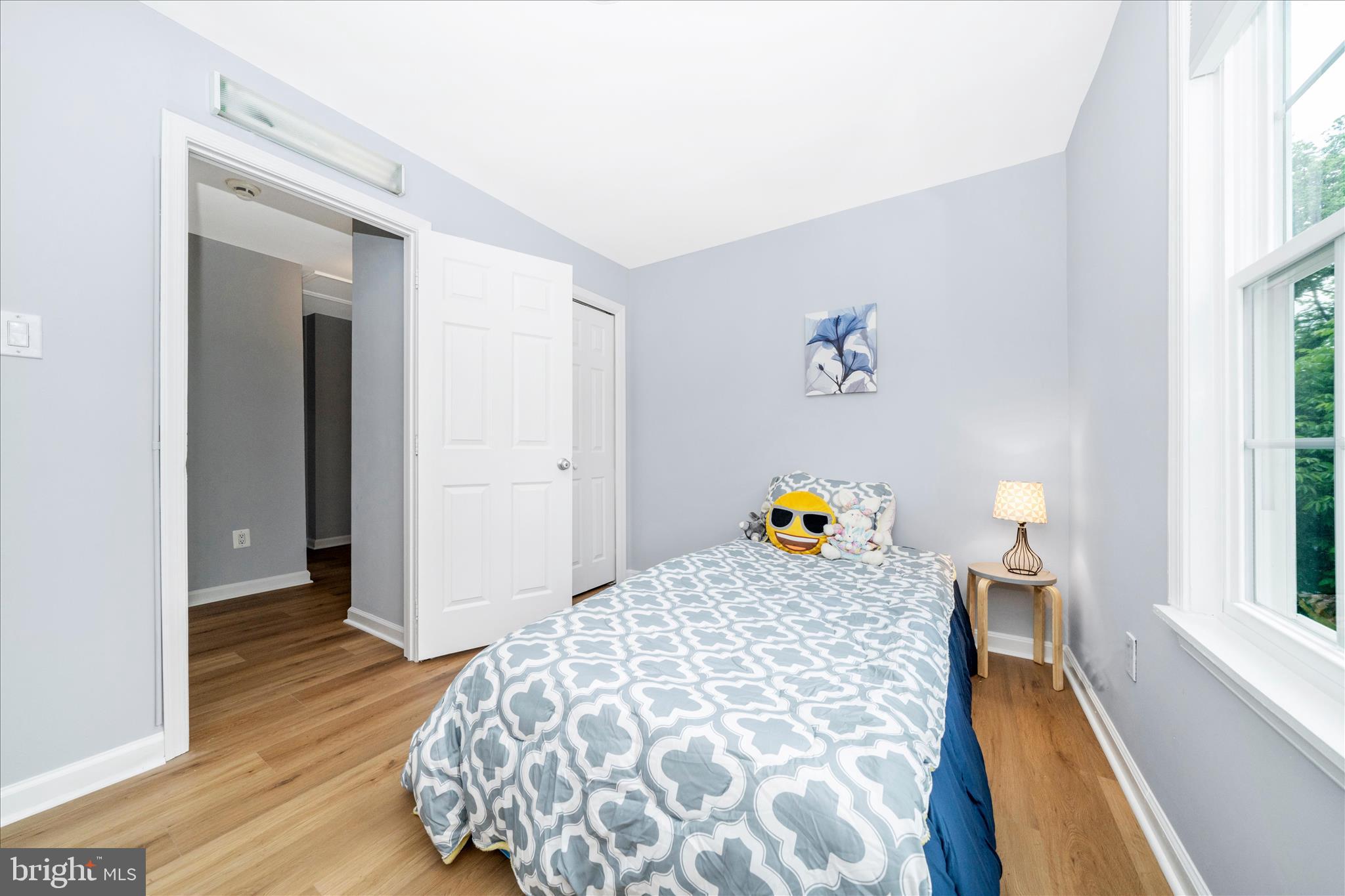 713 Seek Lane Silver Spring, MD 20912 - Photo 24 of 60 a view of living room with a bed and wooden floor