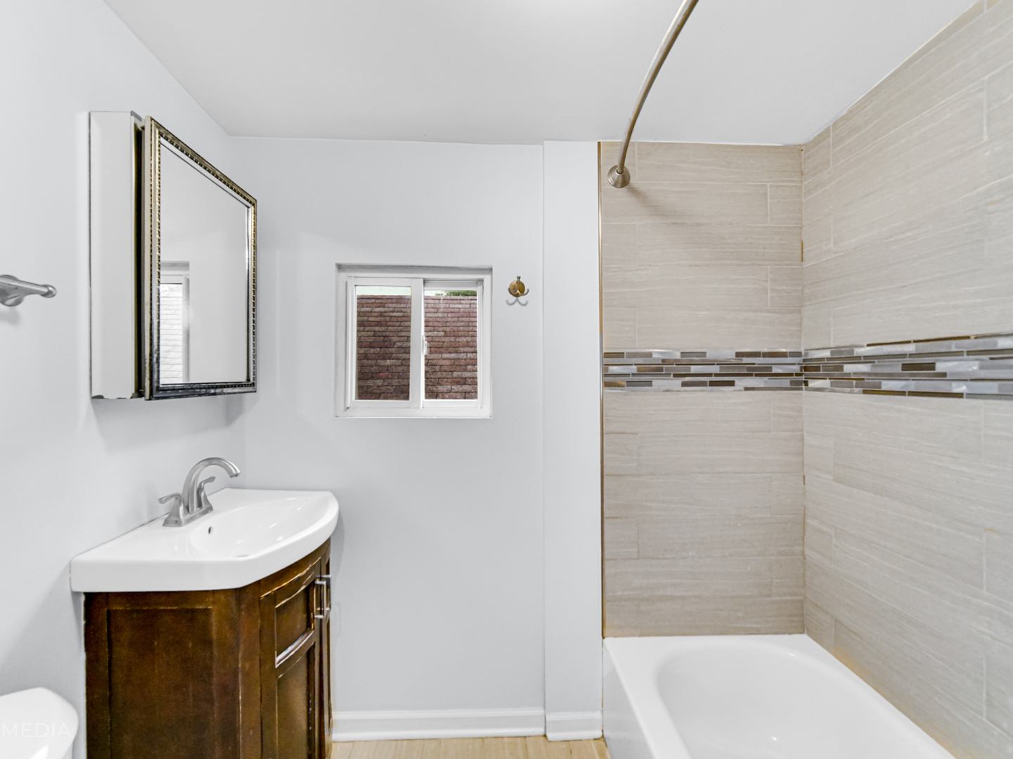 8553 South Sangamon Street Chicago, IL 60620 - Photo 20 of 27 a bathroom with a sink a toilet and shower
