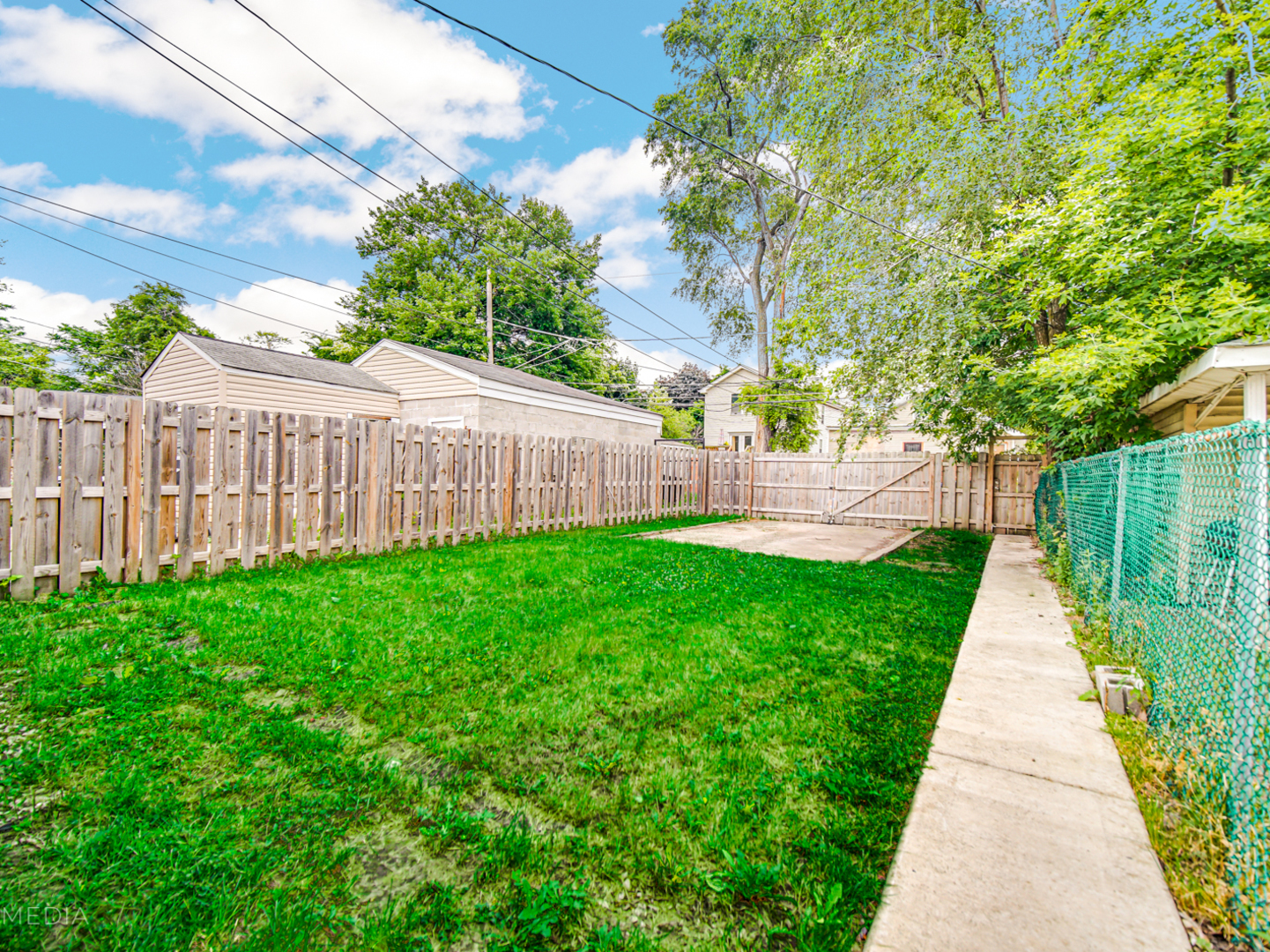 8553 South Sangamon Street Chicago, IL 60620 - Photo 21 of 27 a view of a backyard with pathway