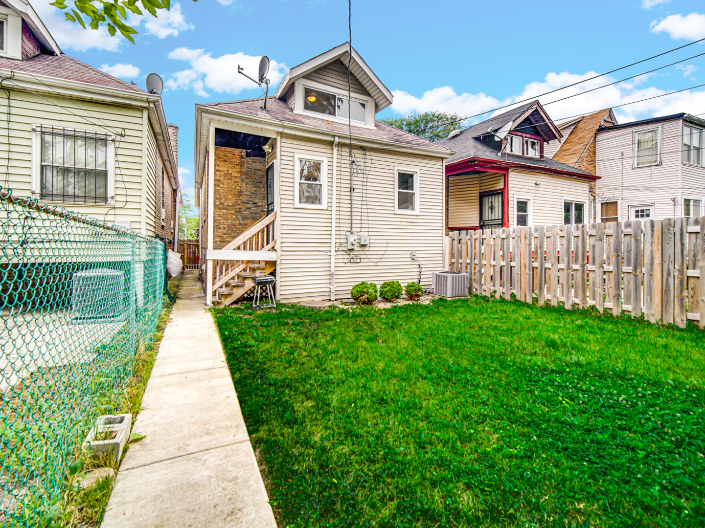 8553 South Sangamon Street Chicago, IL 60620 - Photo 22 of 27 front view of a house with a yard