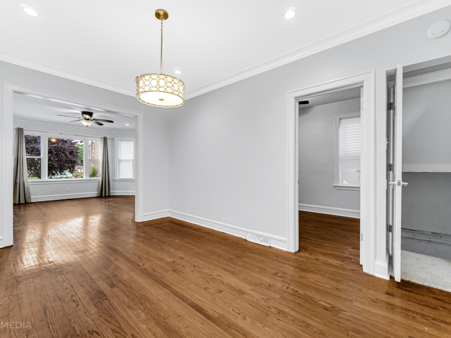 8553 South Sangamon Street Chicago, IL 60620 - Photo 4 of 27 wooden floor in an empty room with a window