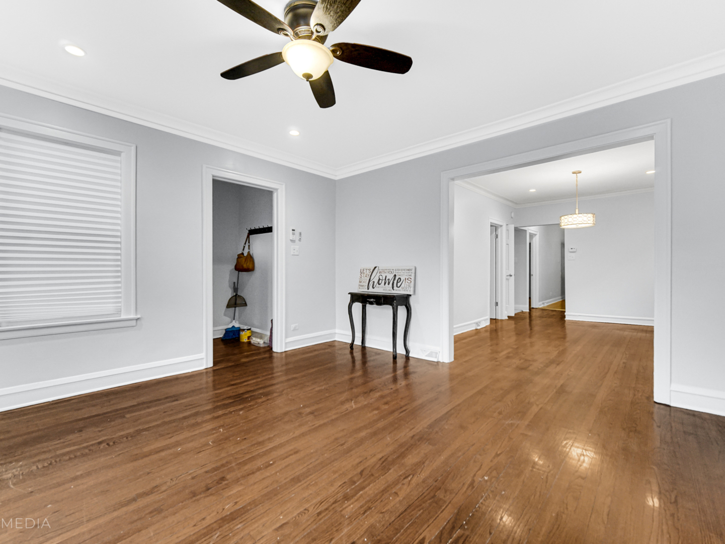 8553 South Sangamon Street Chicago, IL 60620 - Photo 10 of 27 a view of an empty room with window and wooden floor
