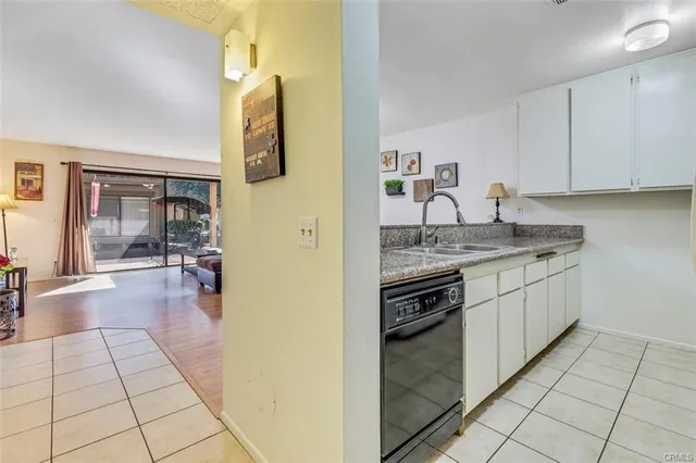 a kitchen with stainless steel appliances granite countertop a stove and a sink
