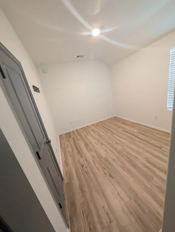 a view of a livingroom with wooden floor