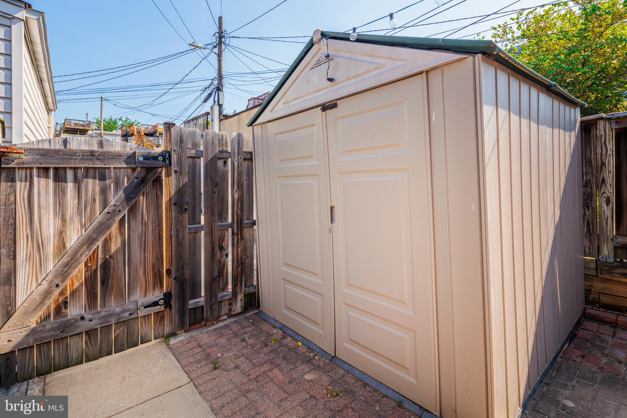 3408 Elliott Street Baltimore, MD 21224 - Photo 37 of 40 7' x 7' storage shed conveys with sale.