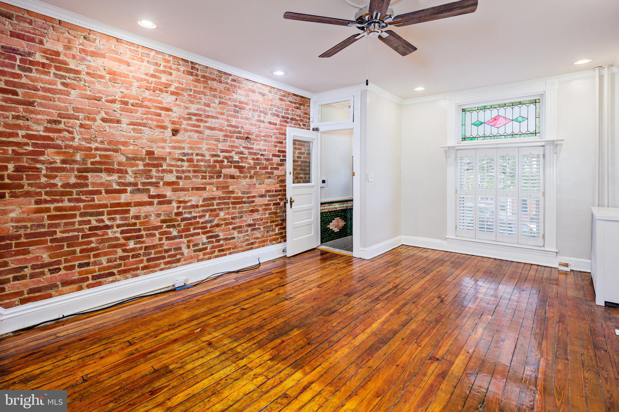 3408 Elliott Street Baltimore, MD 21224 - Photo 4 of 40 Check out that exposed brick!