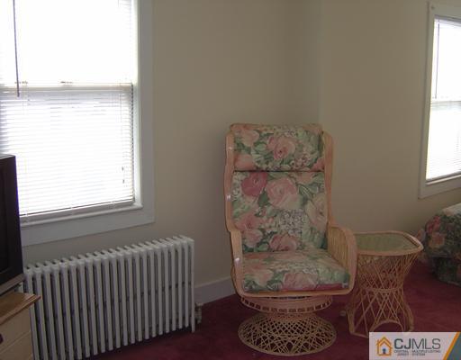 438 Georges Road North Brunswick, NJ 08902 - Photo 8 of 21 a living room with furniture and a window