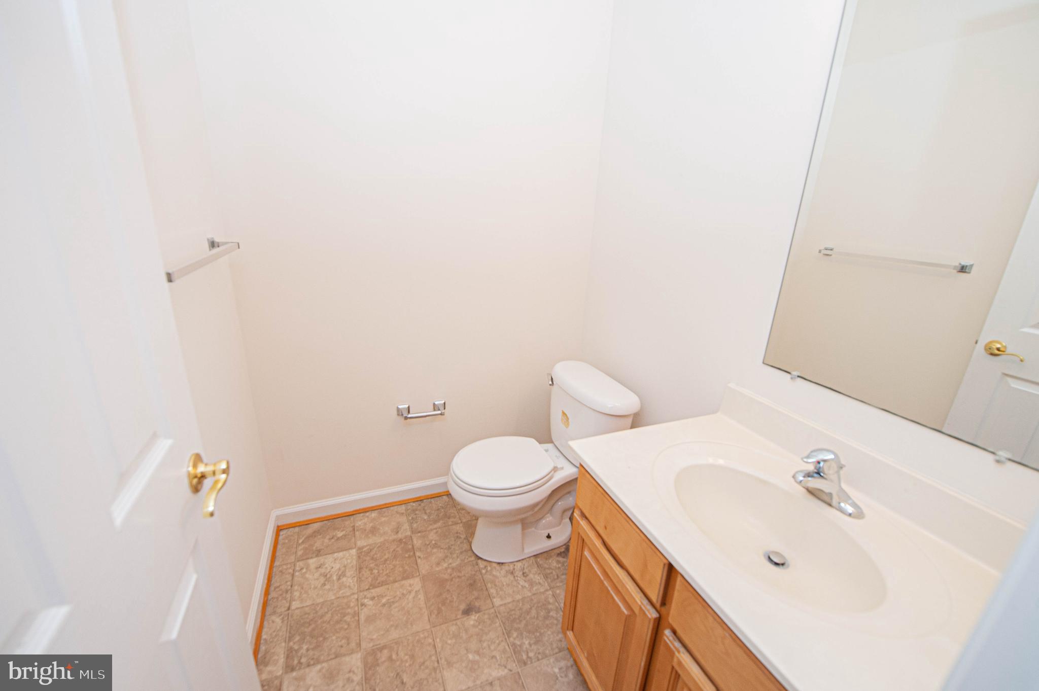 420 Parkview Court, Unit F Salisbury, MD 21804 - Photo 16 of 87 a white toilet sitting next to a bathroom sink
