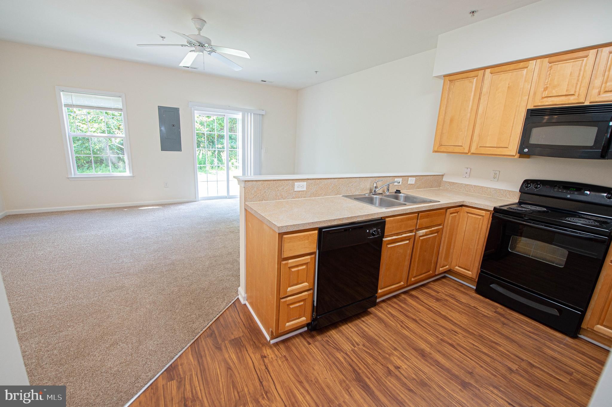 420 Parkview Court, Unit F Salisbury, MD 21804 - Photo 20 of 87 a kitchen with wooden floors and stainless steel appliances