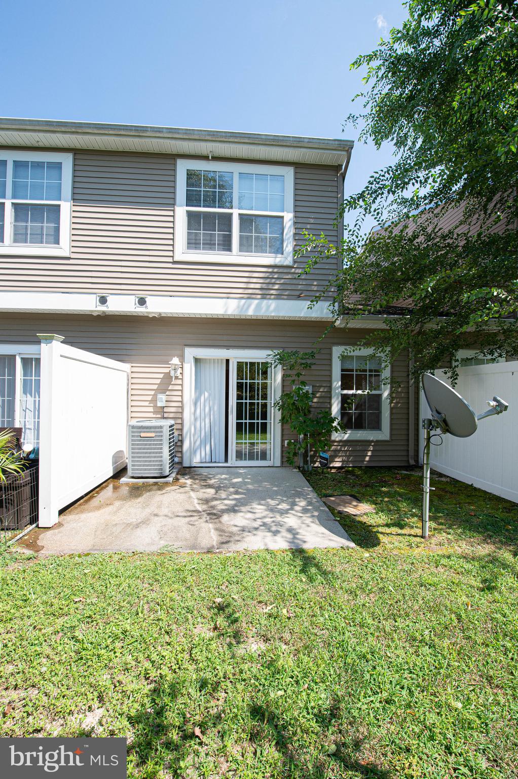 420 Parkview Court, Unit F Salisbury, MD 21804 - Photo 40 of 87 a view of a yard in front of a house with a large tree