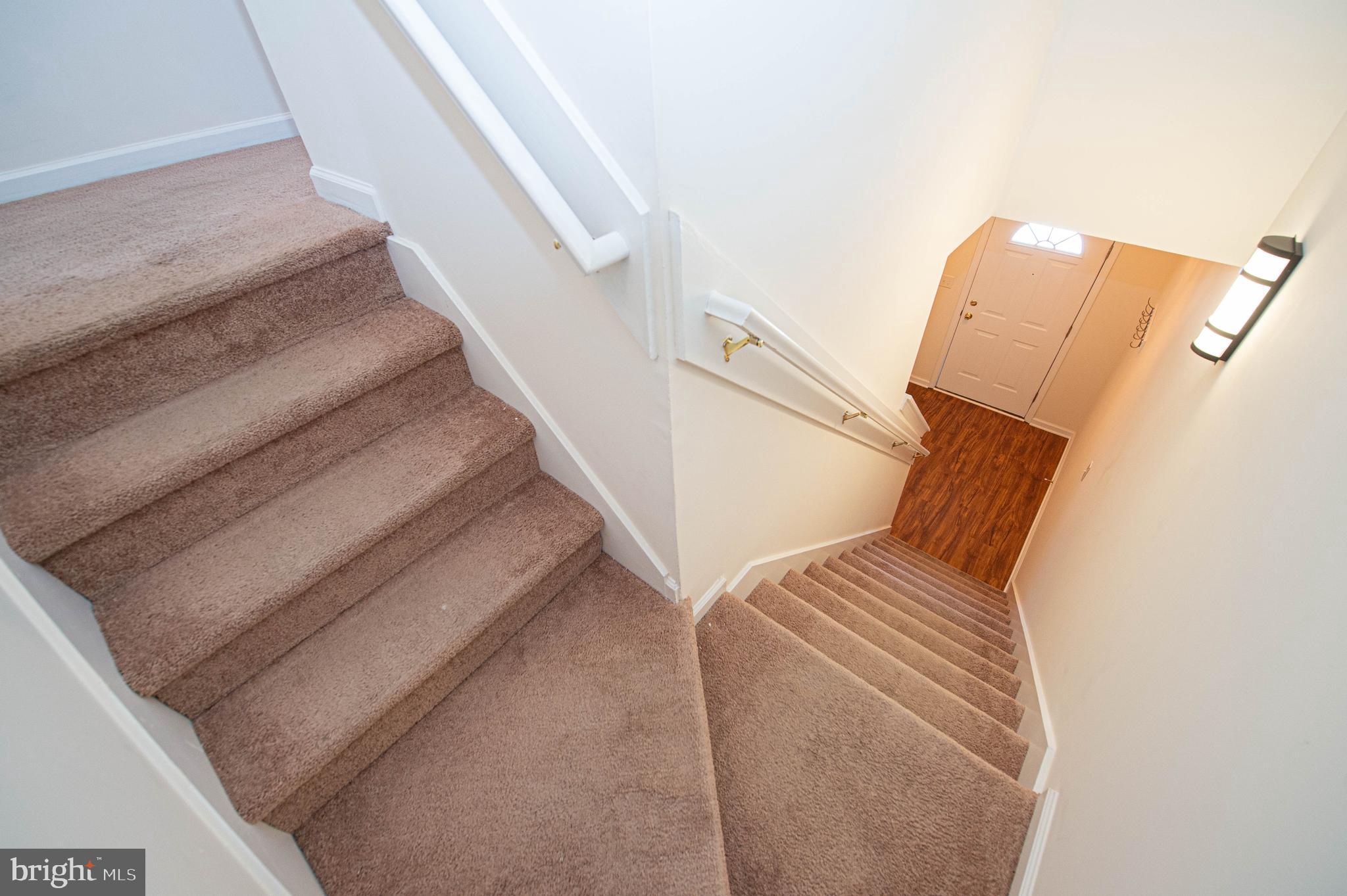 420 Parkview Court, Unit F Salisbury, MD 21804 - Photo 50 of 87 a view of staircase with white walls and stairs