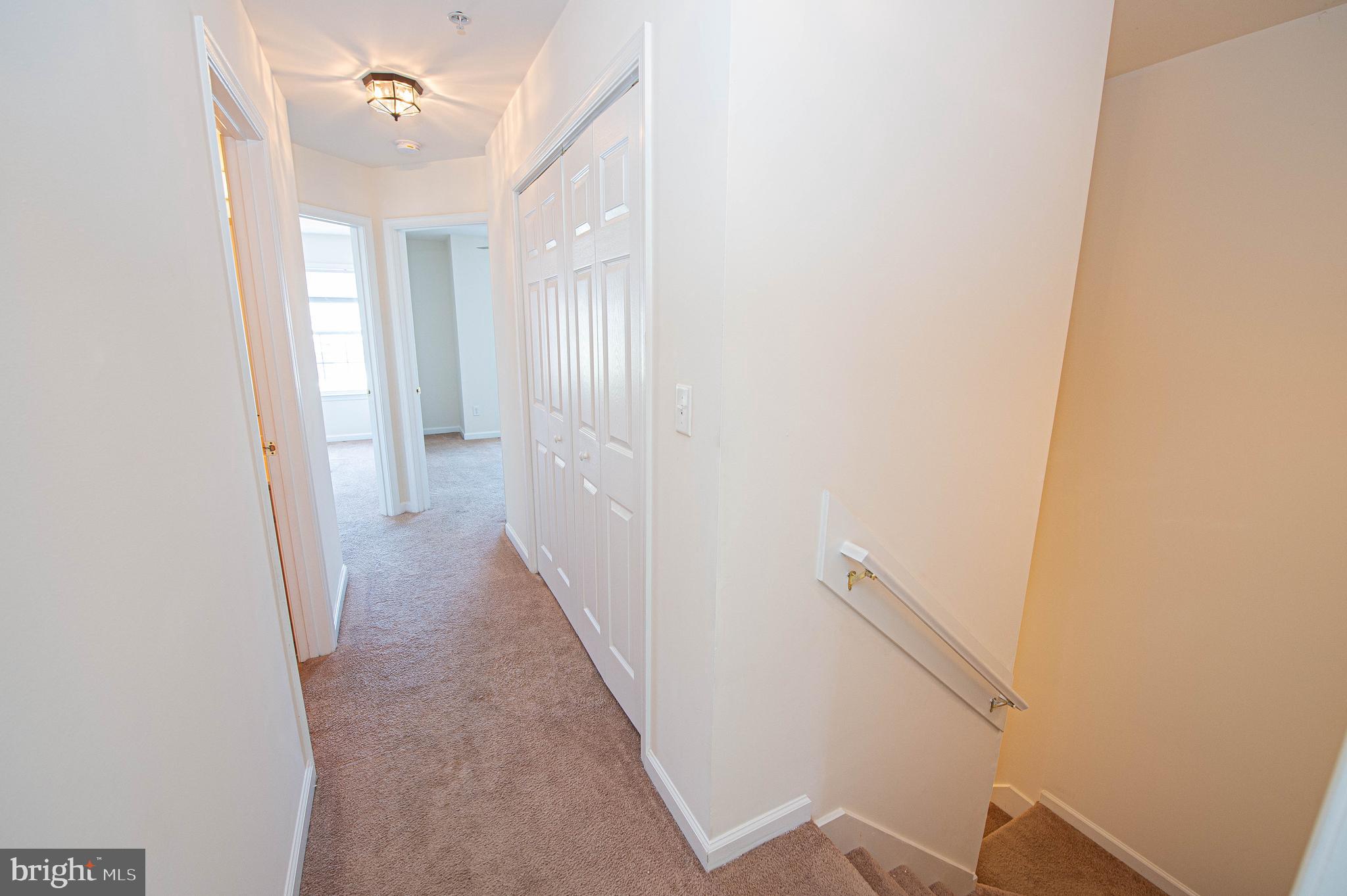 420 Parkview Court, Unit F Salisbury, MD 21804 - Photo 52 of 87 a view of a hallway with wooden floor