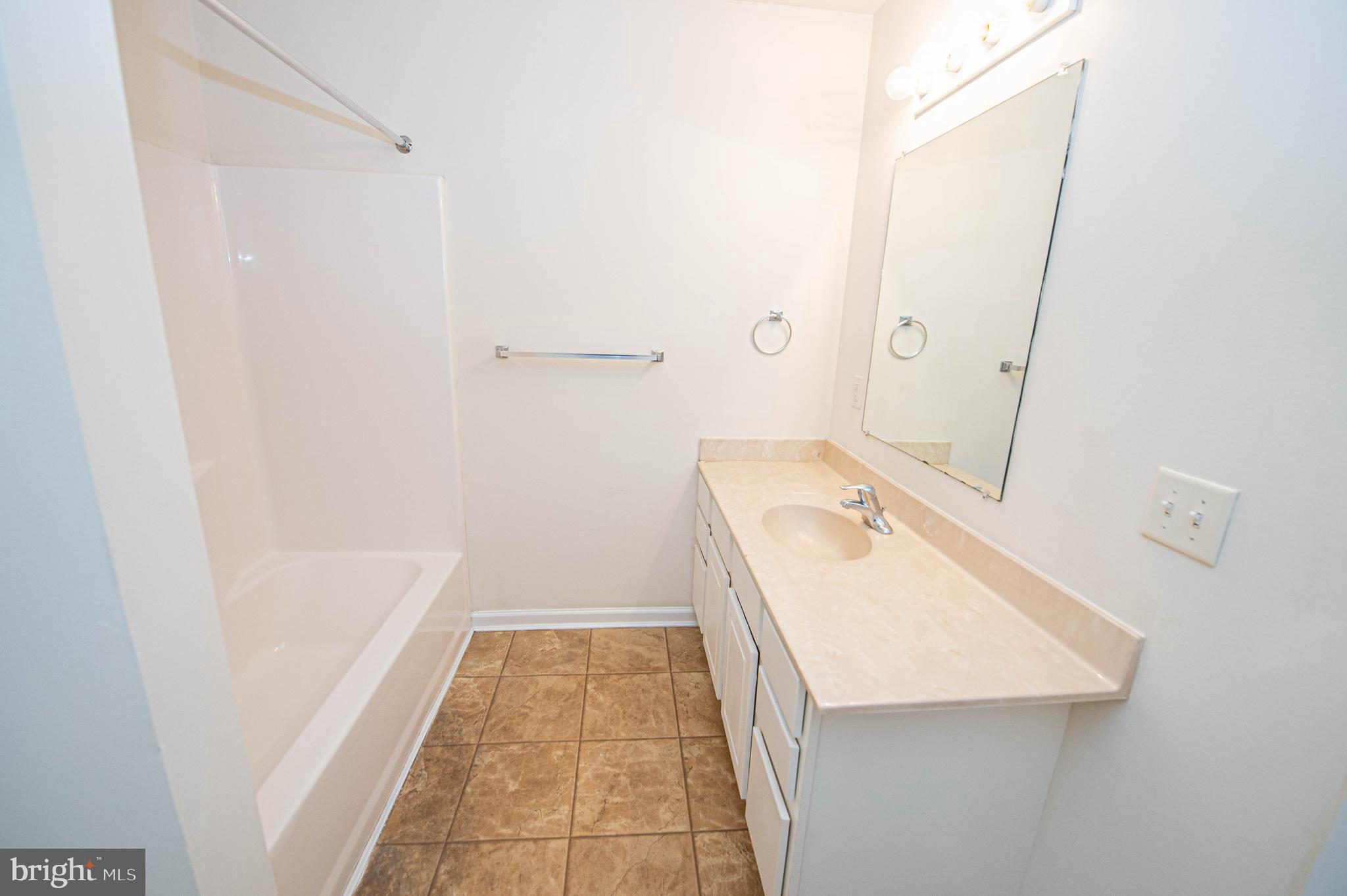 420 Parkview Court, Unit F Salisbury, MD 21804 - Photo 63 of 87 a bathroom with a sink a toilet and shower