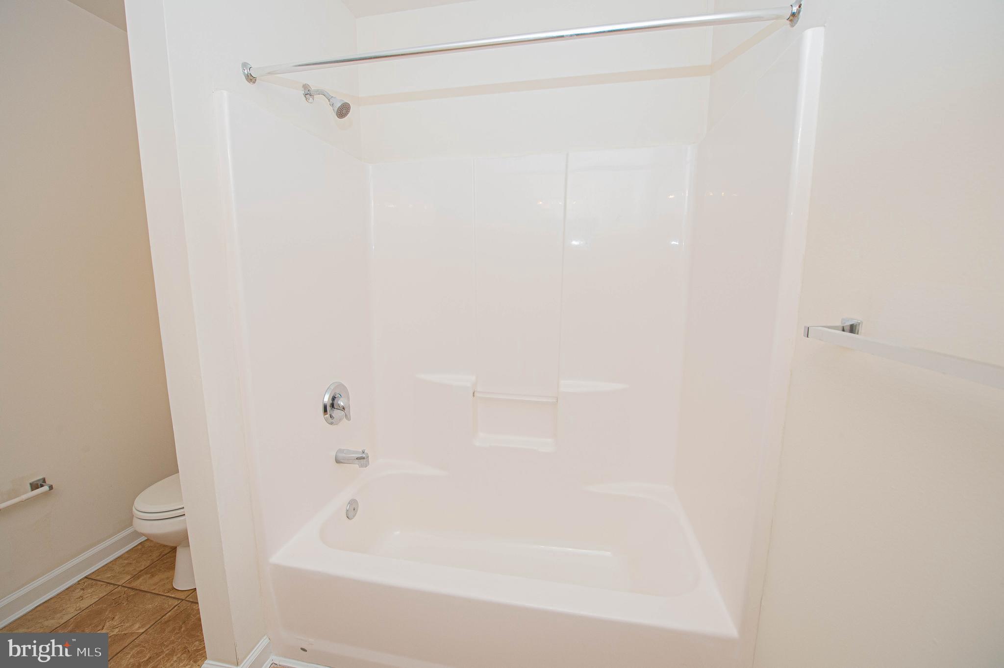 420 Parkview Court, Unit F Salisbury, MD 21804 - Photo 65 of 87 a bathroom with a bathtub and a toilet