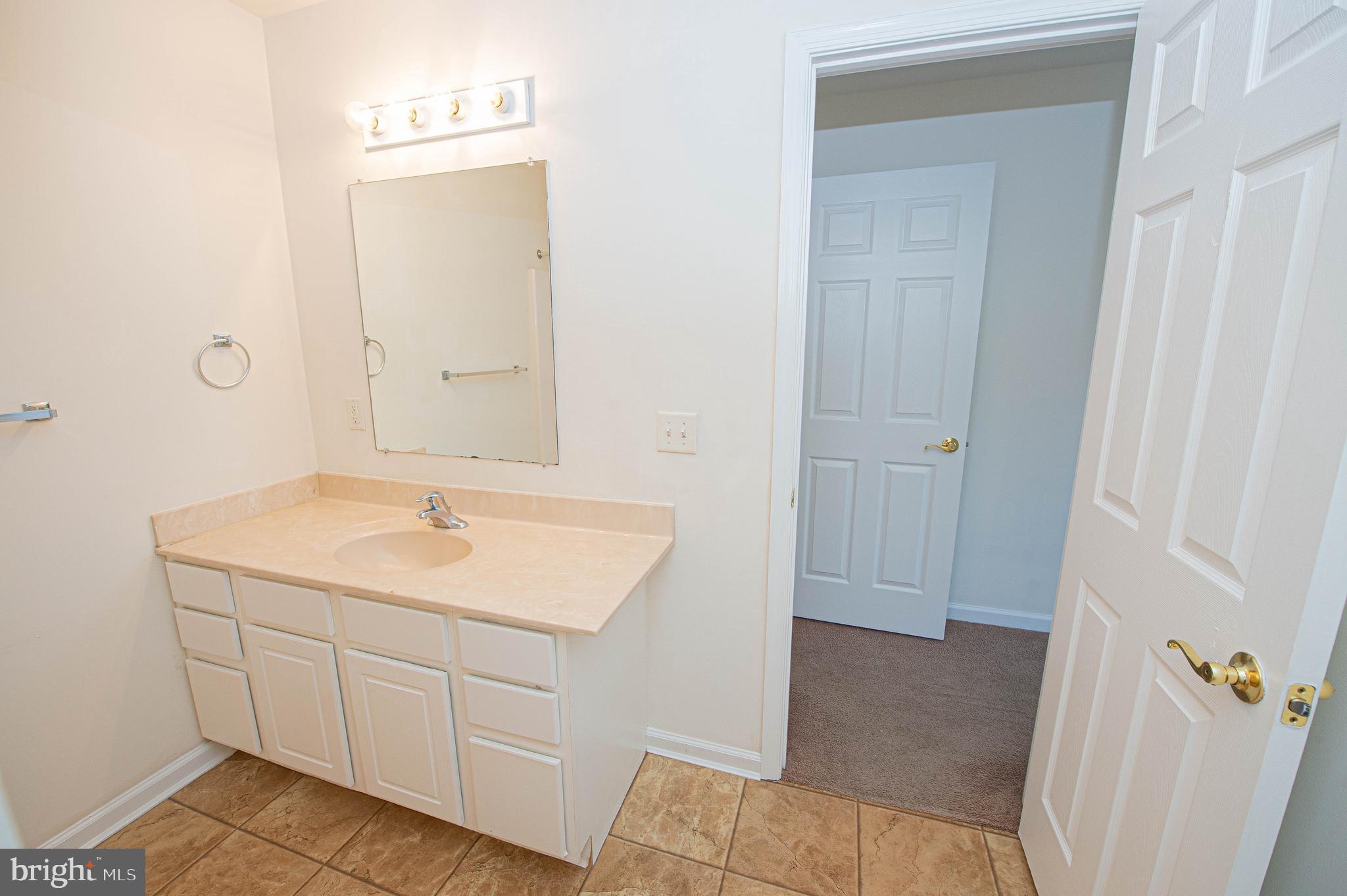 420 Parkview Court, Unit F Salisbury, MD 21804 - Photo 66 of 87 a bathroom with a sink toilet and tub