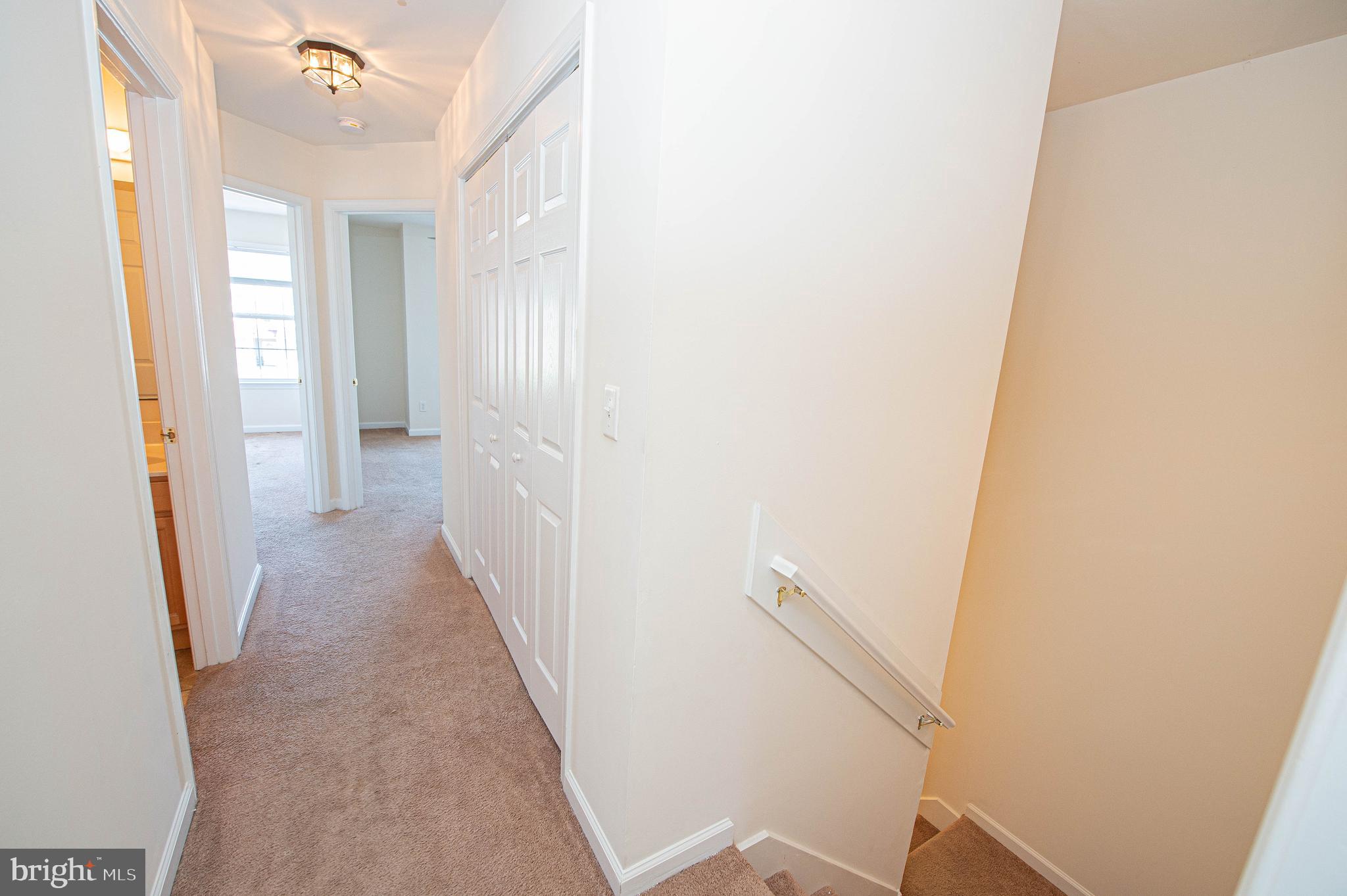 420 Parkview Court, Unit F Salisbury, MD 21804 - Photo 68 of 87 a view of a hallway with wooden floor