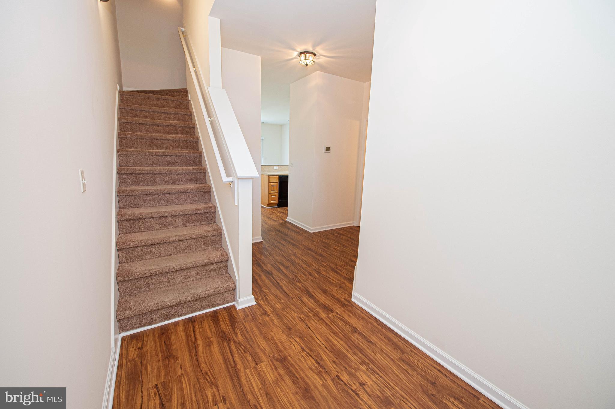 420 Parkview Court, Unit F Salisbury, MD 21804 - Photo 10 of 87 a view of a hallway with wooden floor and entryway