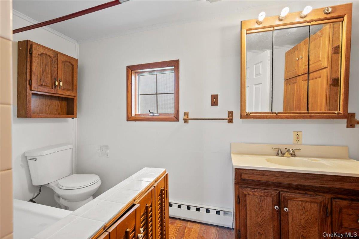 35 Fallkill Avenue Poughkeepsie, NY 12601 - Photo 12 of 21 a bathroom with a sink a toilet and mirror
