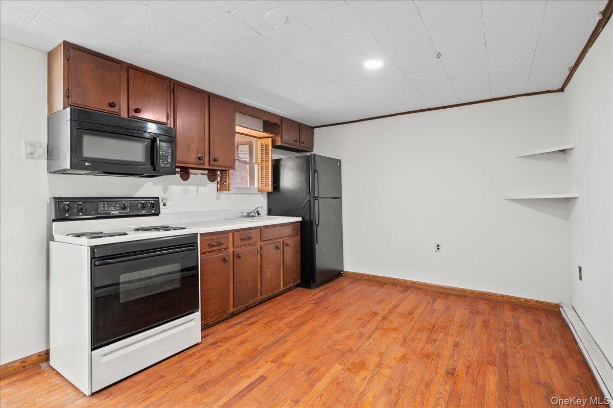 35 Fallkill Avenue Poughkeepsie, NY 12601 - Photo 9 of 21 a kitchen with stainless steel appliances a stove microwave and sink