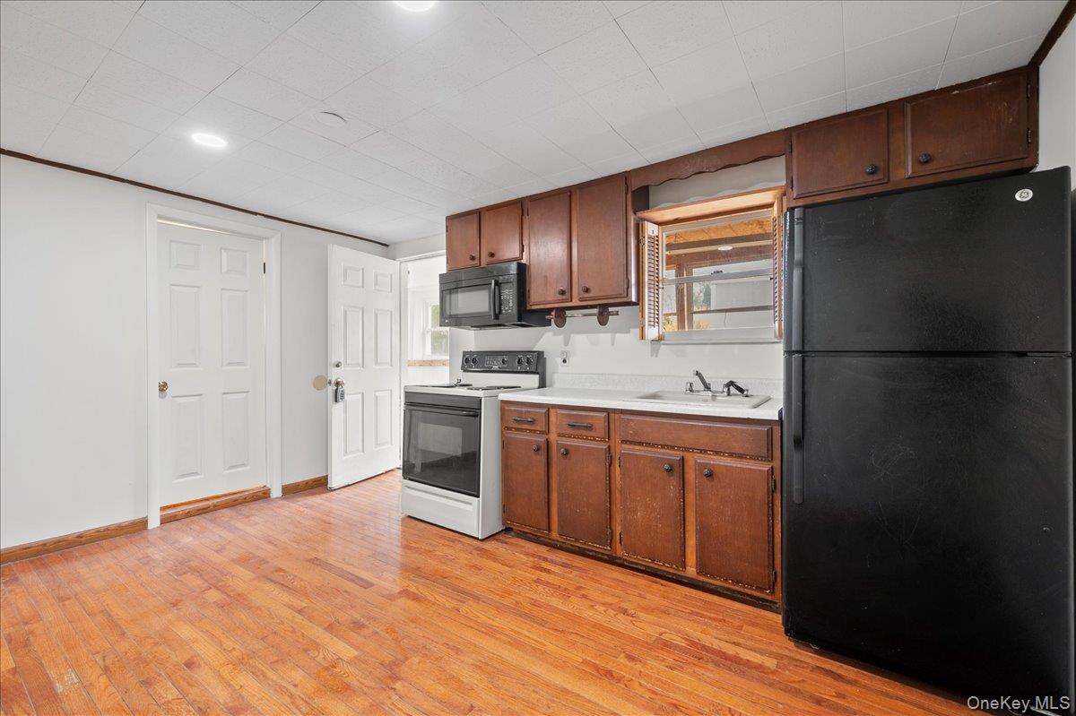 35 Fallkill Avenue Poughkeepsie, NY 12601 - Photo 10 of 21 a kitchen with stainless steel appliances granite countertop a refrigerator sink and cabinets