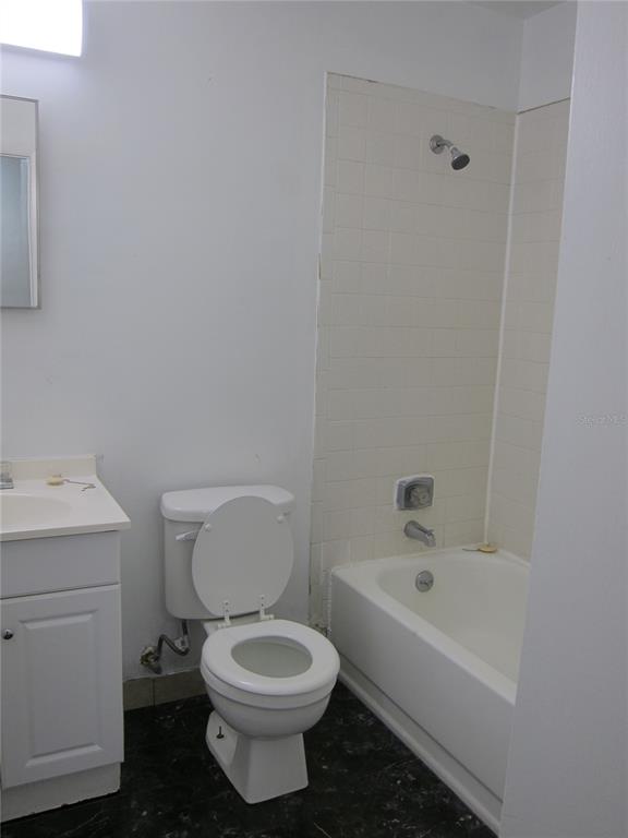 6417 Southwest 9th Avenue, Unit D Gainesville, FL 32607 - Photo 13 of 25 a white toilet sitting next to a white sink
