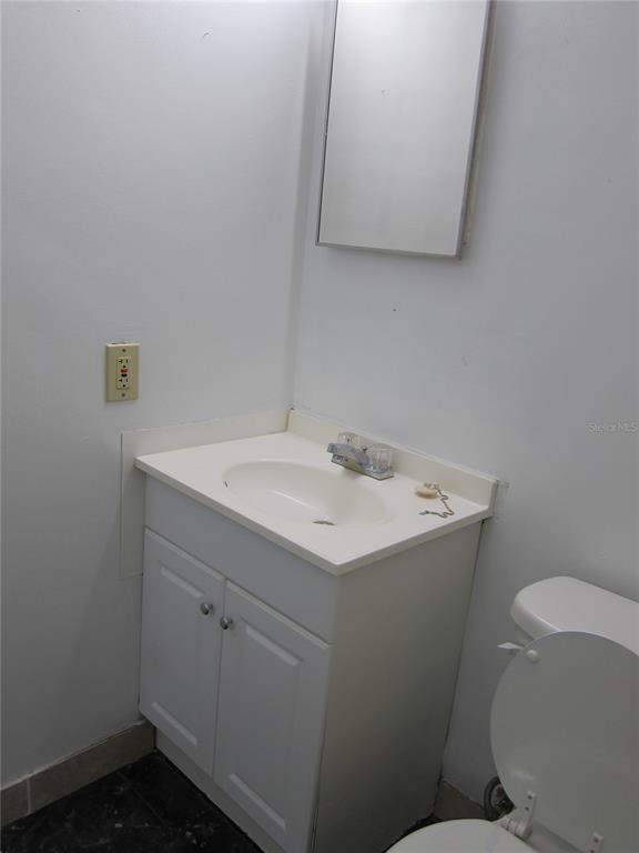 6417 Southwest 9th Avenue, Unit D Gainesville, FL 32607 - Photo 14 of 25 a bathroom with a sink and a toilet