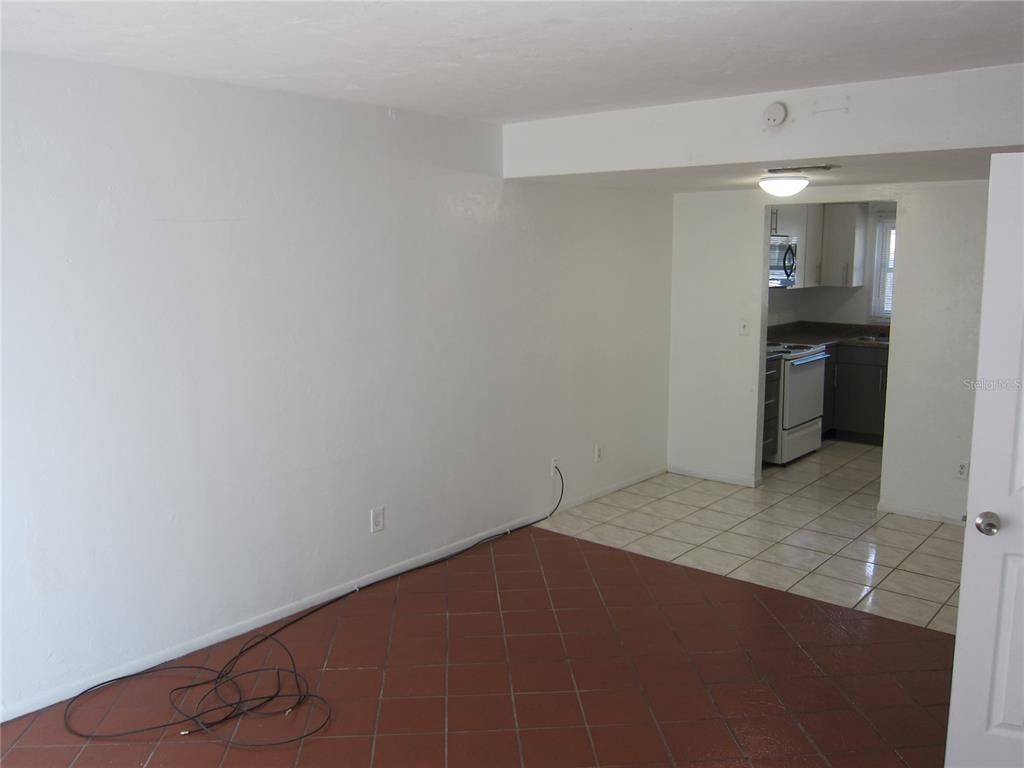 6417 Southwest 9th Avenue, Unit D Gainesville, FL 32607 - Photo 15 of 25 a view of an empty room and a kitchen
