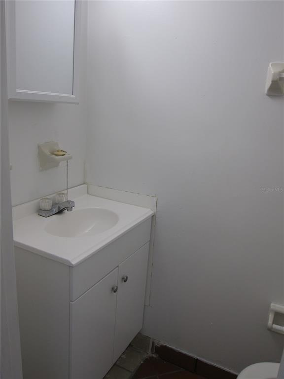 6417 Southwest 9th Avenue, Unit D Gainesville, FL 32607 - Photo 19 of 25 a bathroom with a sink and vanity