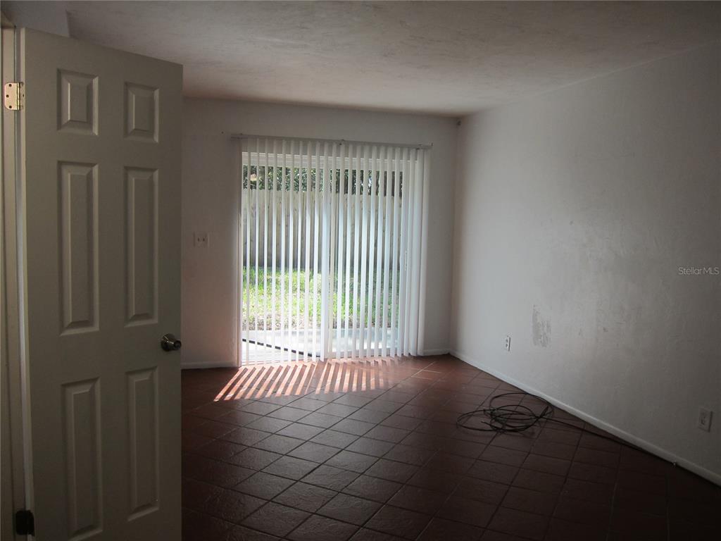 6417 Southwest 9th Avenue, Unit D Gainesville, FL 32607 - Photo 24 of 25 a view of an empty room with a window