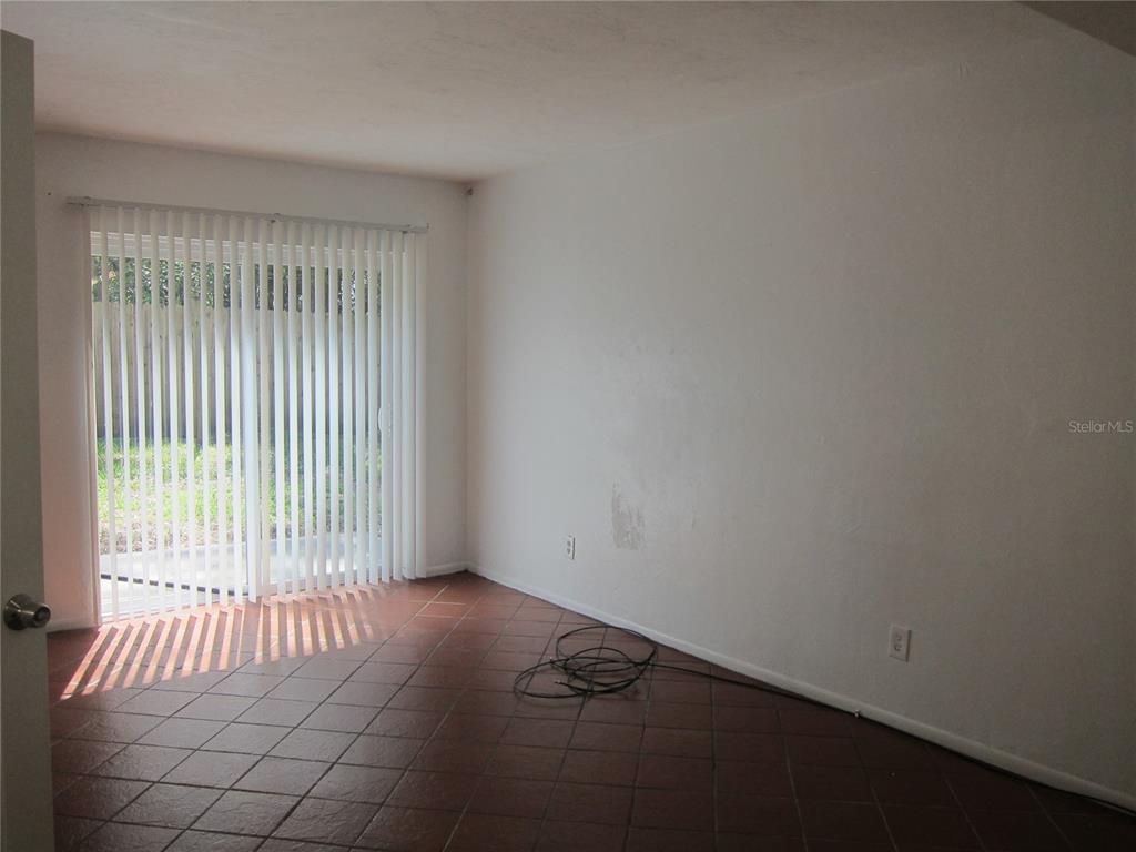 6417 Southwest 9th Avenue, Unit D Gainesville, FL 32607 - Photo 25 of 25 an empty room with windows