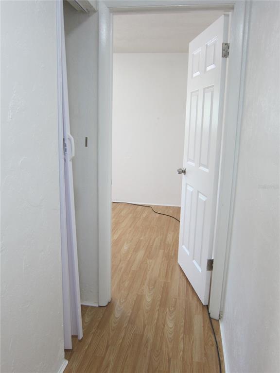 6417 Southwest 9th Avenue, Unit D Gainesville, FL 32607 - Photo 6 of 25 a view of a hallway with wooden floor
