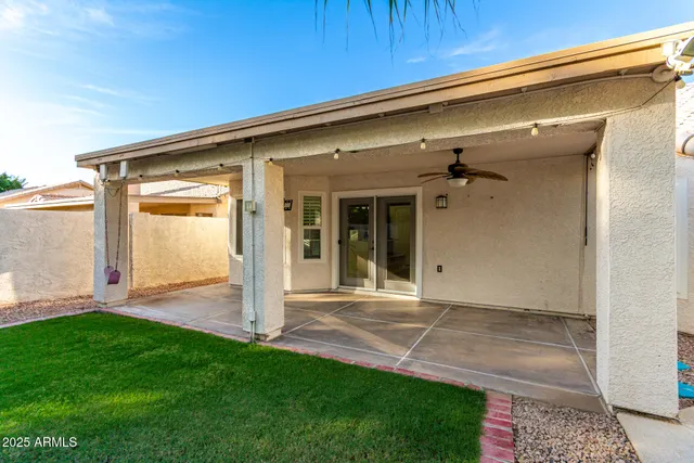 a view of a swimming pool with a patio