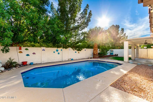 swimming pool with an outdoor seating