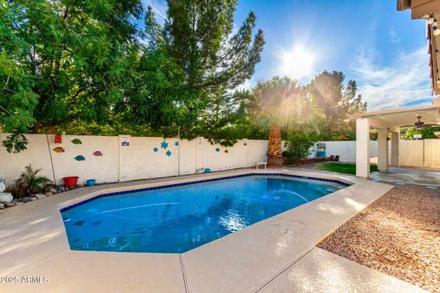 swimming pool with an outdoor seating