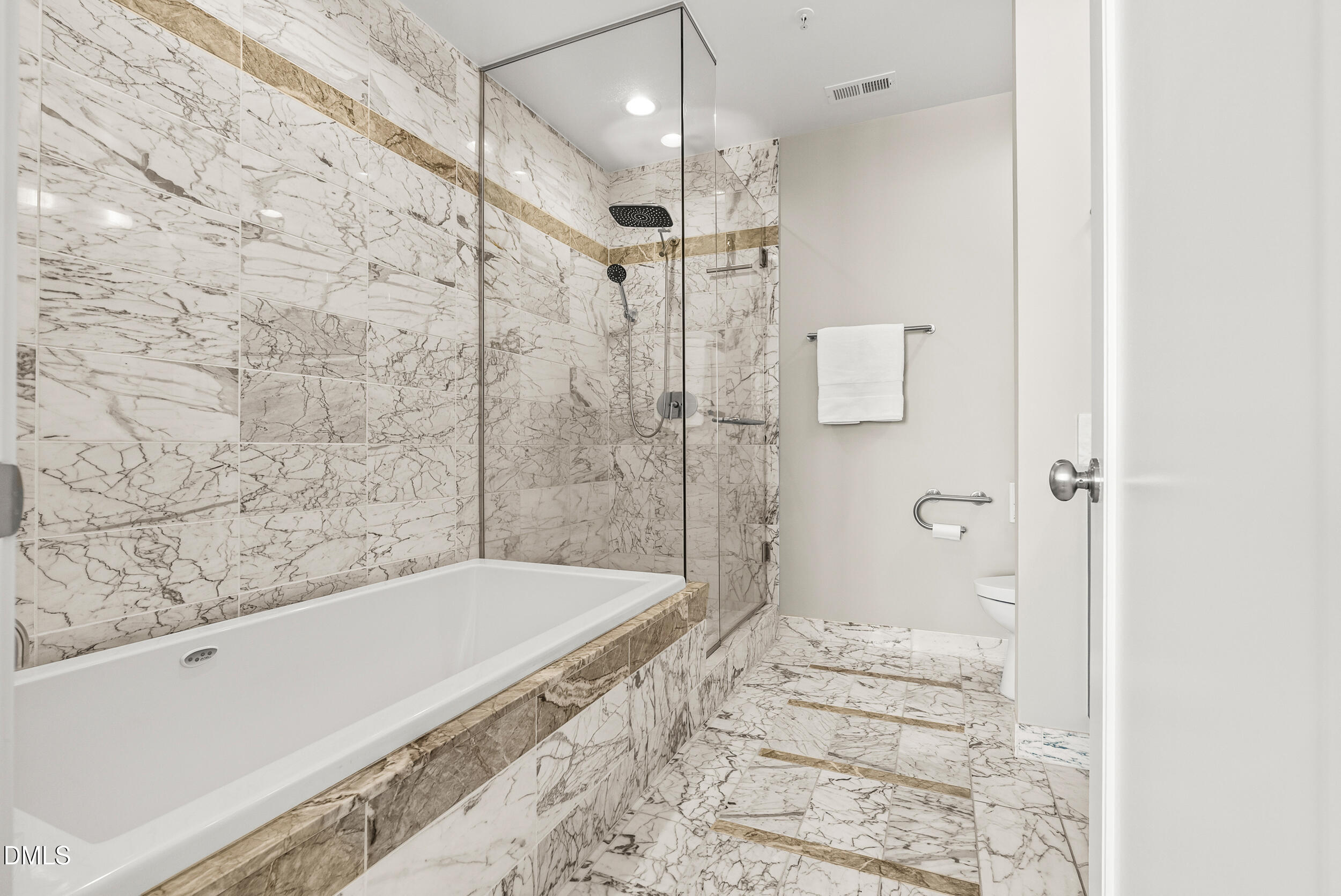 122 North Harrington Street Raleigh, NC 27603 - Photo 21 of 46 a bathroom with a bathtub and shower