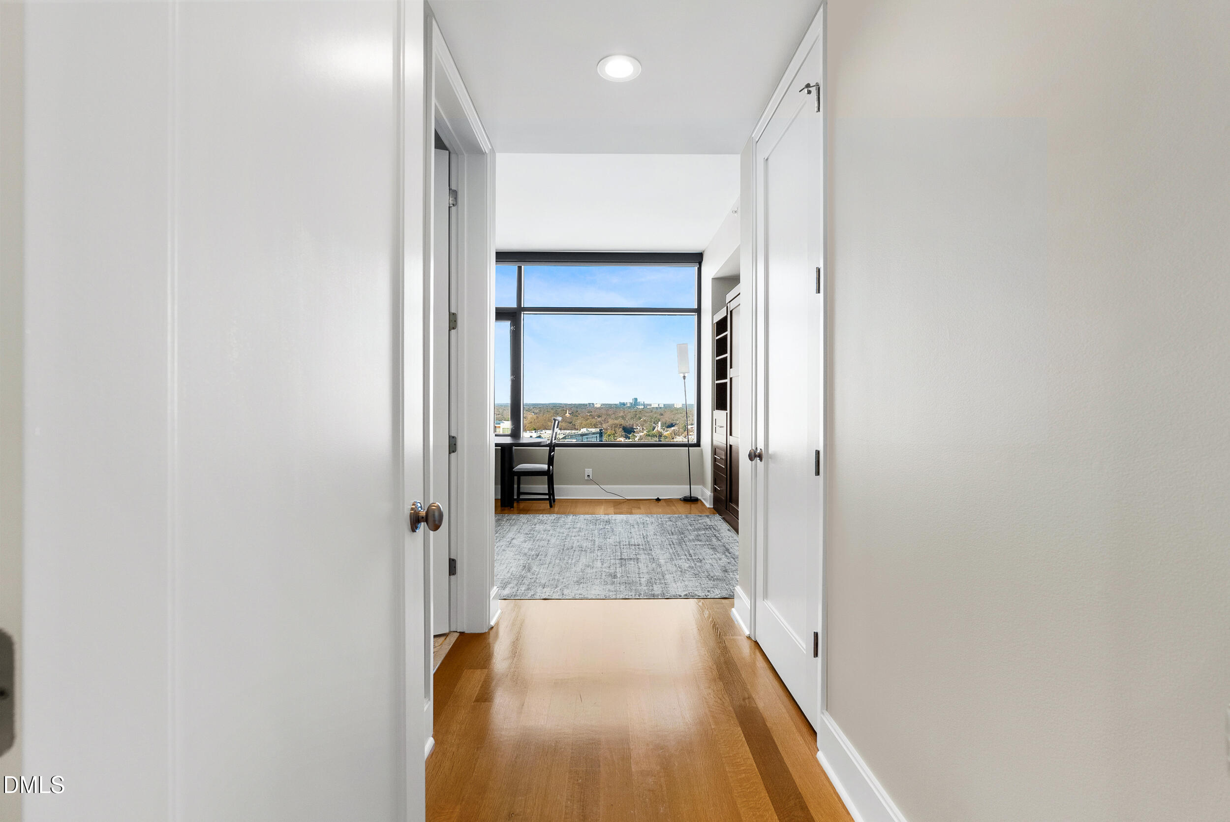 122 North Harrington Street Raleigh, NC 27603 - Photo 24 of 46 a view of a hallway with wooden floor and a refrigerator