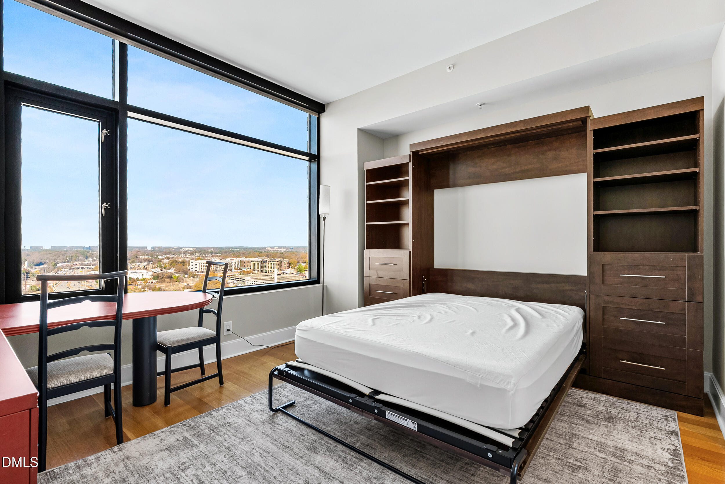 122 North Harrington Street Raleigh, NC 27603 - Photo 26 of 46 a bedroom with a bed and large window