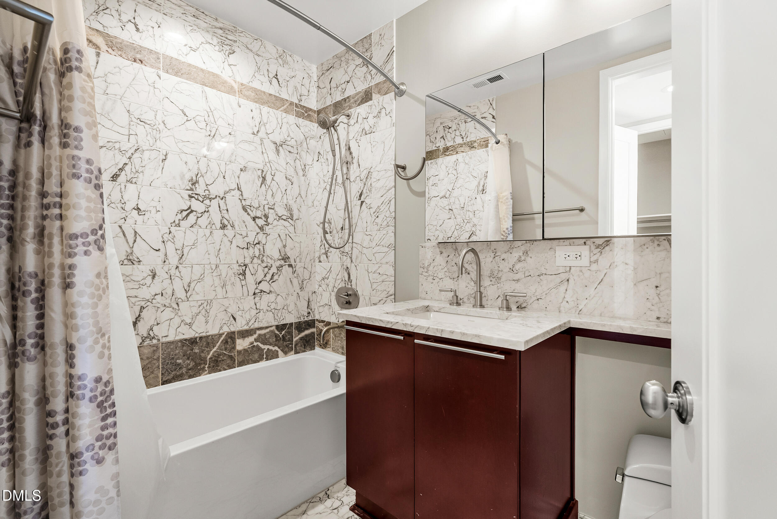 122 North Harrington Street Raleigh, NC 27603 - Photo 27 of 46 a bathroom with a sink and a bathtub